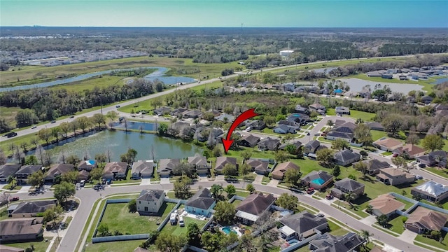 aerial view with a residential view and a water view