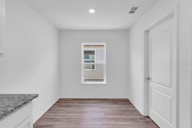 2674 SW 165th Street Rd, Ocala, FL 34473 - spare room featuring light wood-style floors, baseboards, and recessed lighting