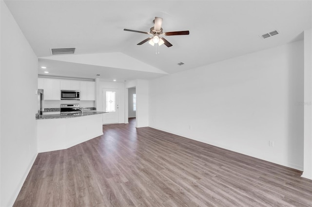 2674 SW 165th Street Rd, Ocala, FL 34473 - unfurnished living room featuring lofted ceiling, a ceiling fan, wood finished floors, and recessed lighting