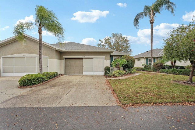 view of front facade featuring stucco siding, an attached garage, and concrete driveway