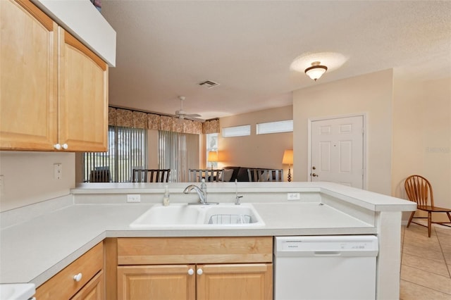 kitchen with visible vents, a ceiling fan, light brown cabinetry, a sink, and dishwasher