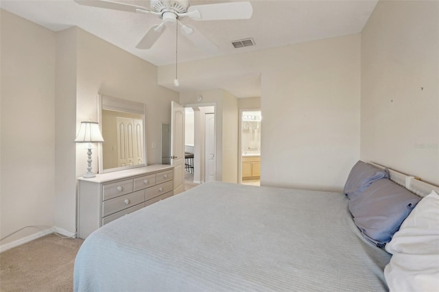 bedroom featuring connected bathroom, baseboards, visible vents, and light carpet