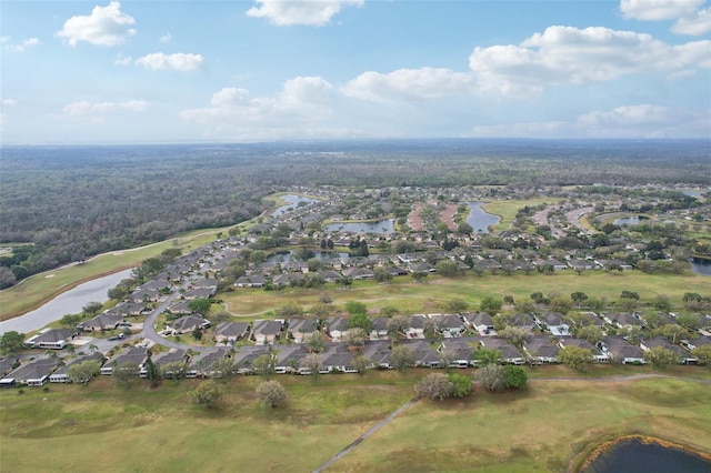 aerial view with a residential view, golf course view, and a water view