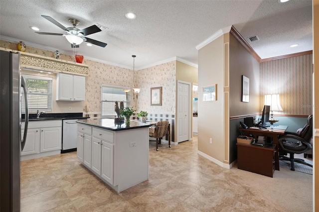 3798 Darston St, Palm Harbor, FL 34685 - kitchen with crown molding, stainless steel appliances, and wallpapered walls