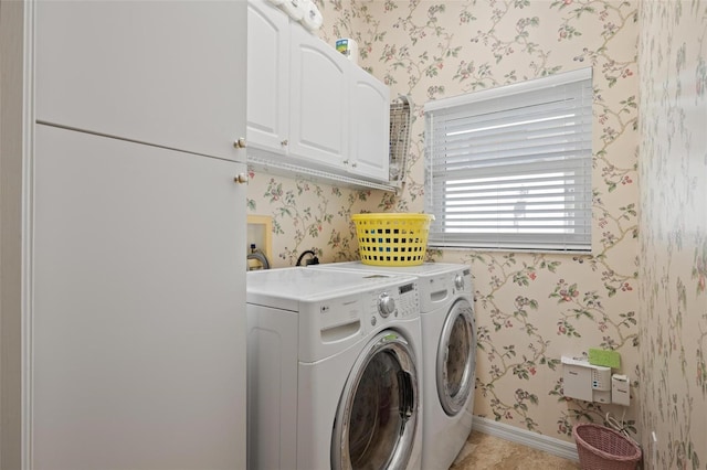 3798 Darston St, Palm Harbor, FL 34685 - laundry area featuring wallpapered walls, washing machine and dryer, baseboards, and cabinet space