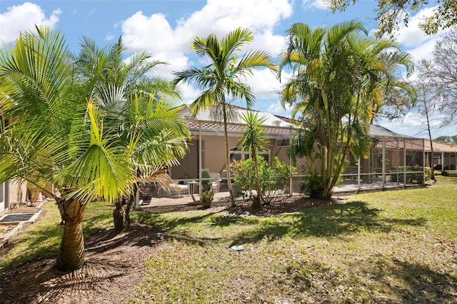 3798 Darston St, Palm Harbor, FL 34685 - view of yard with glass enclosure and a patio area