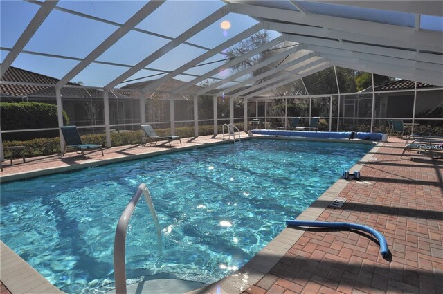 3798 Darston St, Palm Harbor, FL 34685 - view of swimming pool featuring a lanai, a covered pool, and a patio