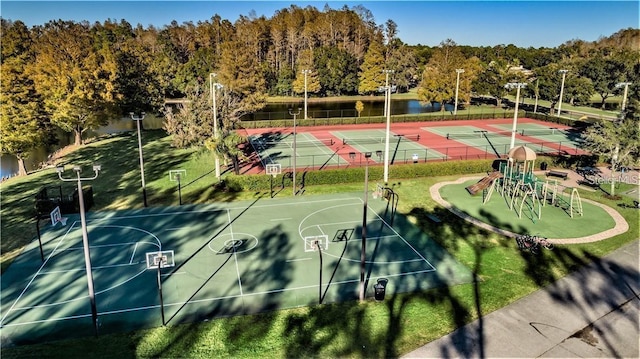 3798 Darston St, Palm Harbor, FL 34685 - view of tennis court with community basketball court, a view of trees, and fence