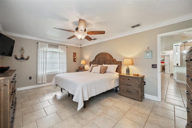 bedroom with visible vents, crown molding, and baseboards