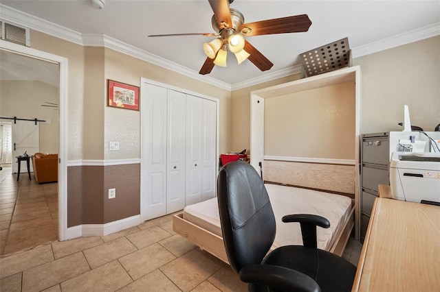 home office with ornamental molding, a ceiling fan, visible vents, and a barn door