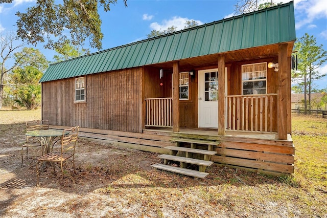 exterior space with metal roof