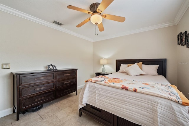 bedroom featuring baseboards, visible vents, and crown molding