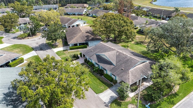 bird's eye view with a residential view and a water view