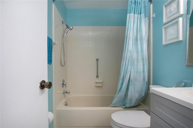 bathroom featuring vanity, toilet, and shower / bath combo with shower curtain