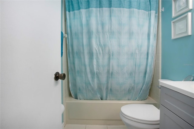 bathroom with toilet, shower / bath combination with curtain, and vanity