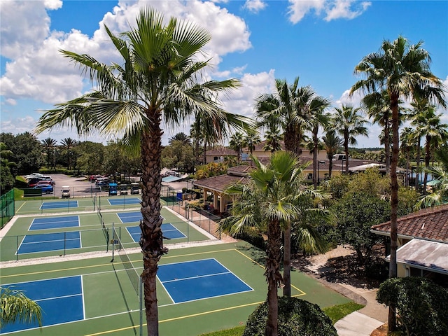 view of tennis court featuring fence