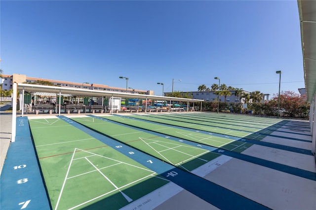 view of property's community featuring shuffleboard