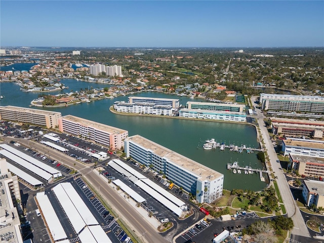 birds eye view of property featuring a water view and a city view