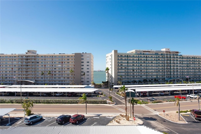 view of property featuring uncovered parking