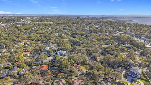 drone / aerial view with a water view and a residential view