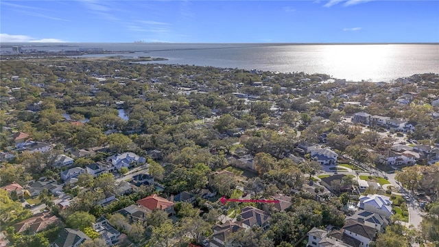 drone / aerial view featuring a residential view and a water view