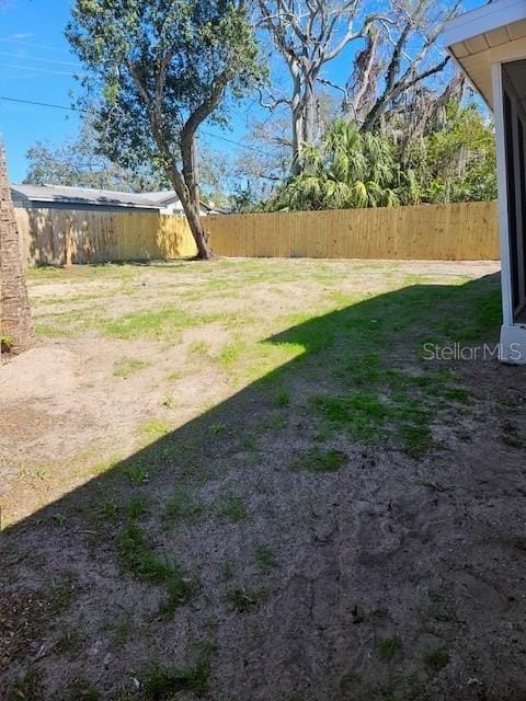 view of yard with fence