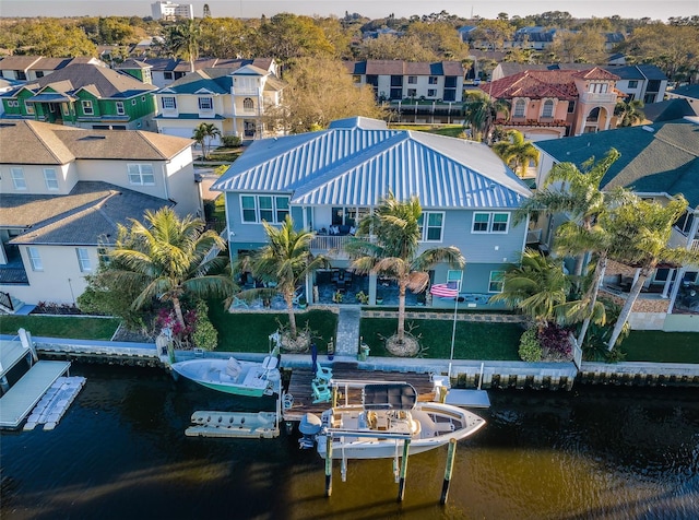 bird's eye view with a water view and a residential view