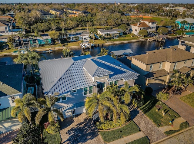 bird's eye view featuring a water view and a residential view