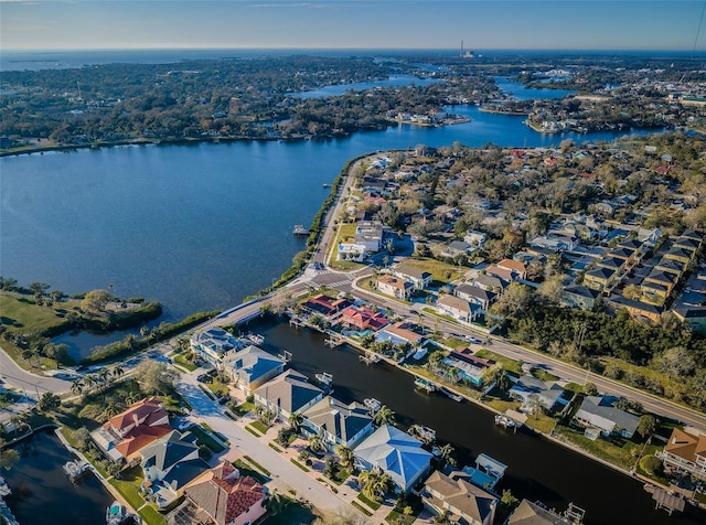 birds eye view of property with a water view and a residential view