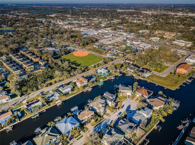 bird's eye view featuring a water view and a residential view