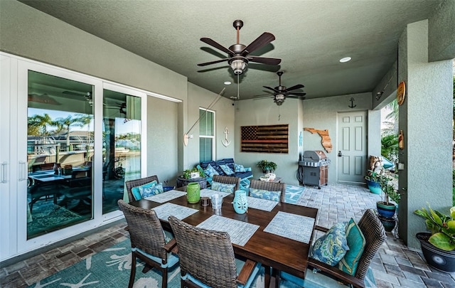 view of patio with a ceiling fan, grilling area, and an outdoor hangout area