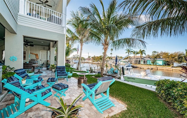 view of patio / terrace with a dock, a balcony, and boat lift