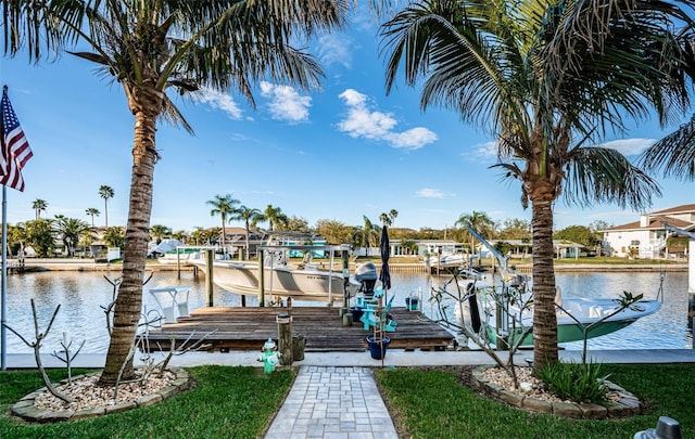 dock area with a water view and boat lift