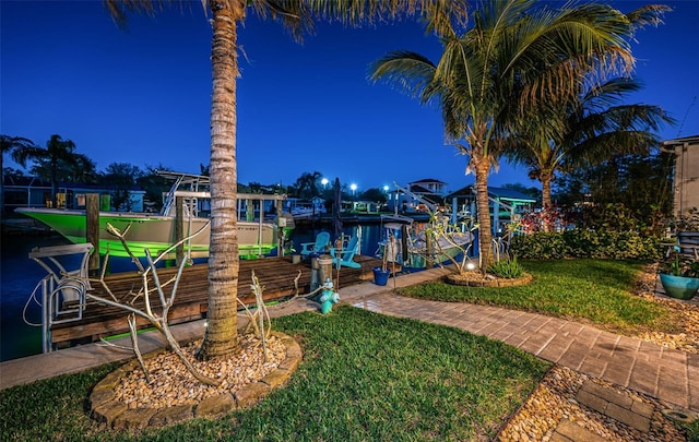 exterior space with a dock and boat lift