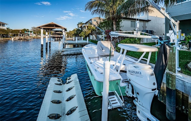 dock area featuring a water view and boat lift