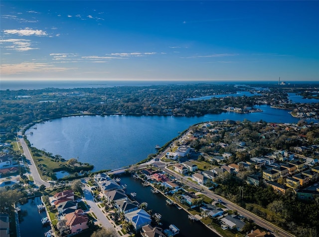 birds eye view of property featuring a water view and a residential view