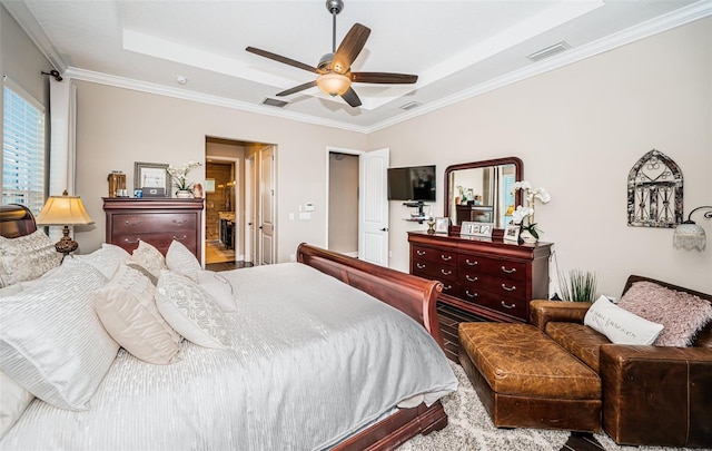 bedroom with a ceiling fan, a raised ceiling, visible vents, and crown molding