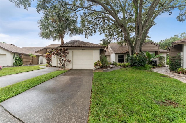 ranch-style home featuring a garage, driveway, a front lawn, and stucco siding