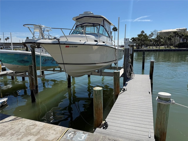 dock area featuring a water view and boat lift