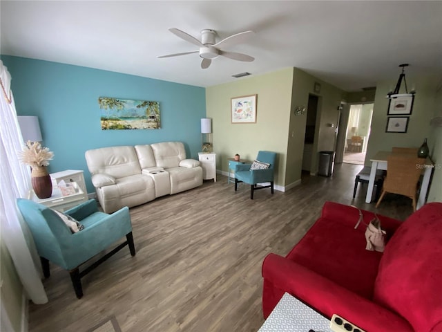 11201 80th Ave Unit 305, Seminole, FL 33772 - living area featuring a ceiling fan, baseboards, visible vents, and wood finished floors