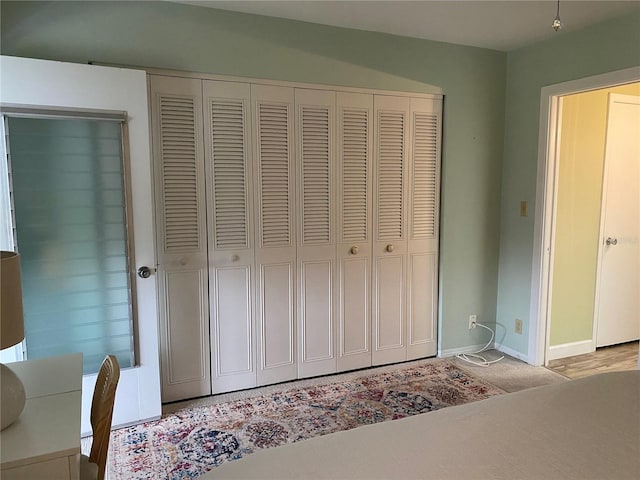 11201 80th Ave Unit 305, Seminole, FL 33772 - bedroom with a closet and baseboards
