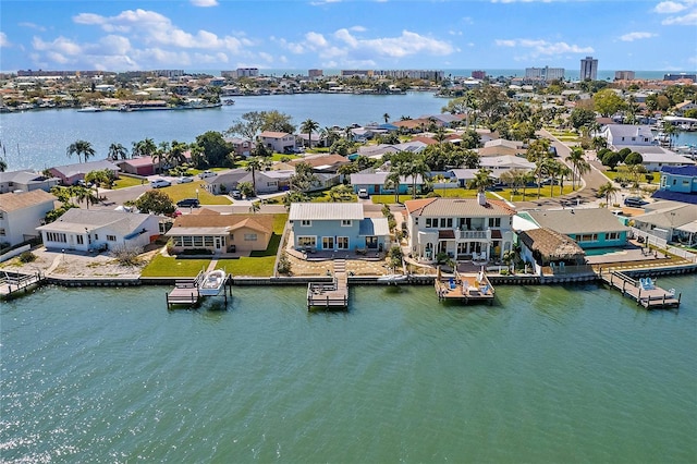 birds eye view of property featuring a residential view and a water view