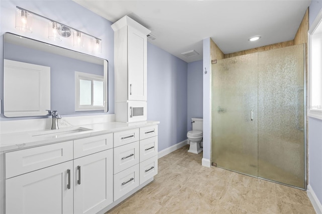 full bathroom featuring visible vents, toilet, a stall shower, baseboards, and vanity