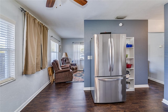 kitchen featuring a ceiling fan, visible vents, wood finished floors, baseboards, and freestanding refrigerator