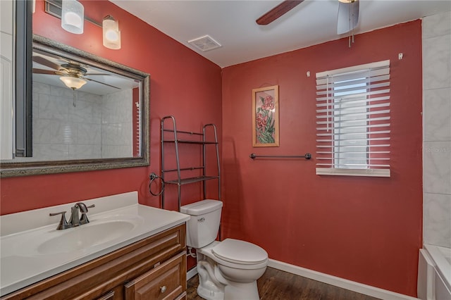 bathroom featuring visible vents, baseboards, toilet, vanity, and a ceiling fan