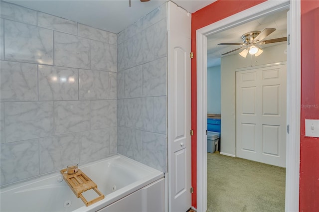 full bath featuring a tub with jets and ceiling fan