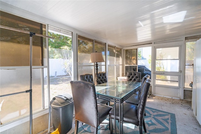 sunroom / solarium featuring a healthy amount of sunlight