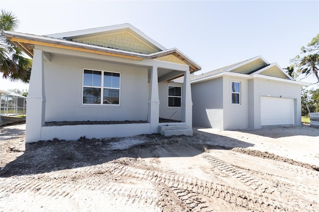 view of front of home featuring an attached garage and stucco siding