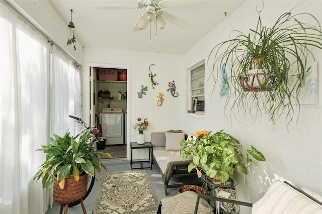 sunroom / solarium with washer / dryer and a ceiling fan