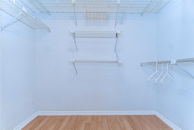 spacious closet with wood finished floors